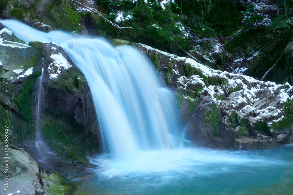 Fototapeta premium Little cascade with ice and icicles
