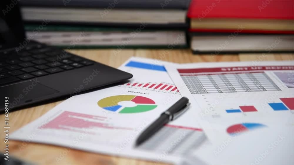 Office Desktop With Business Items, Stock Report, Laptop, Pen And Diary Office Desktop With Business Items, Stock Report, Laptop, Pen And Diary