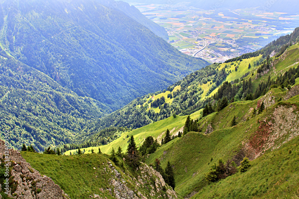 Fototapeta premium Panoramic view of the Alps in Switzerland on a hot summer day