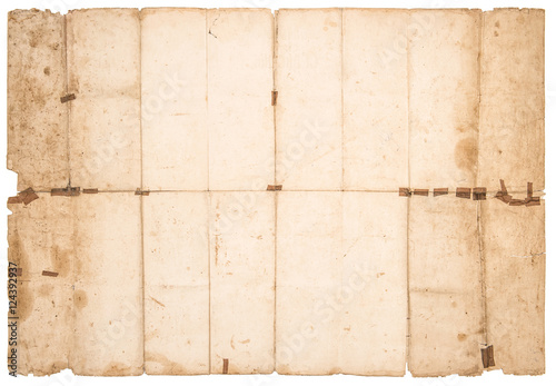 Used stained paper texture. Old grungy falded paper sheet