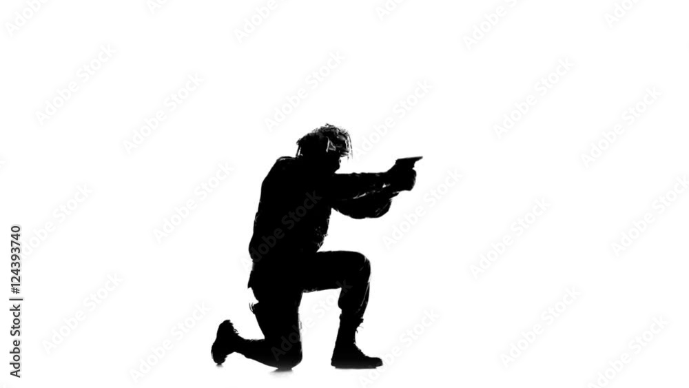 Man sent a weapon to the side. Silhouette Man sent a weapon to the side. Silhouette