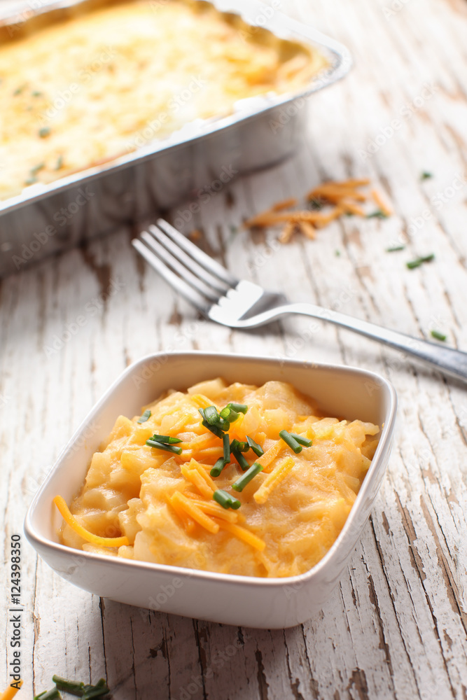 Au gratin funeral cheesy potatoes with chives and sharp cheddar cheese