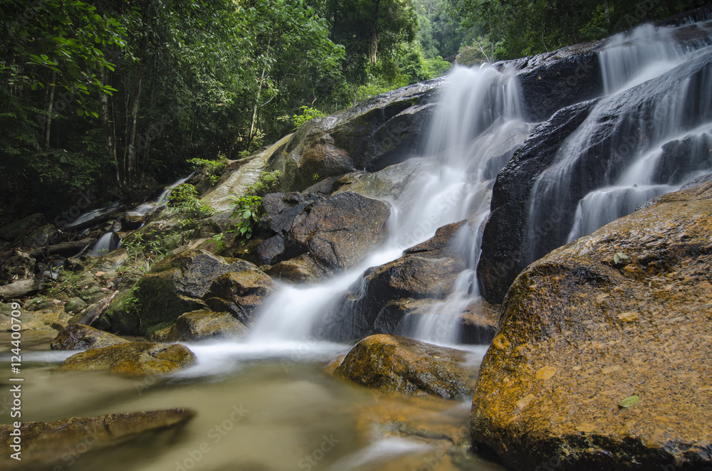 Fototapeta premium beautiful in nature, amazing cascading tropical waterfall. wet a