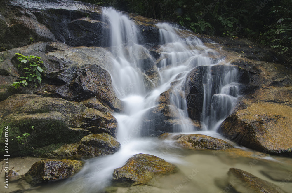 beautiful in nature, amazing cascading tropical waterfall. wet a
