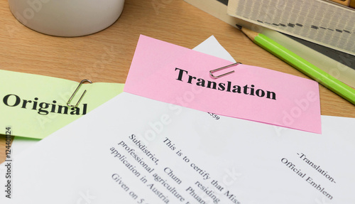 translation paper on wooden table photo