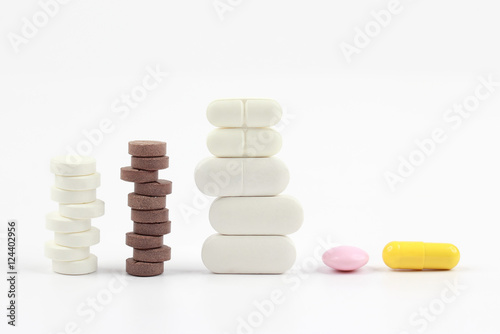 different medicinal pills on white background