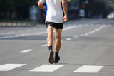 feet running athlete at the distance of a marathon