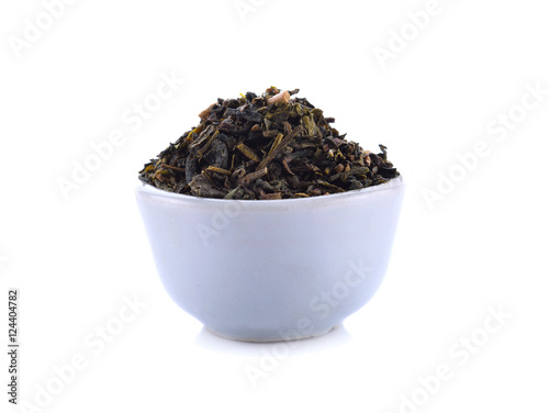 Green tea in a cup of white on white background.