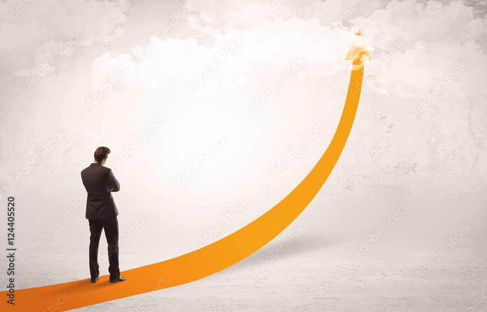 Obraz premium Business person standing on orange arrow
