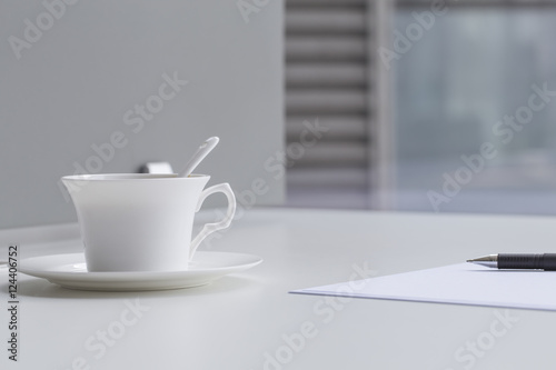 Business concept , blank paper and cup of fresh coffee on the table in office 