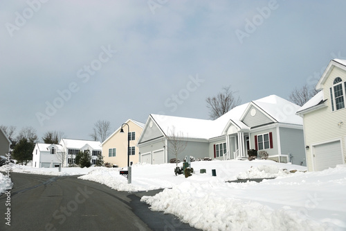 houses in residential community after snow in winter
