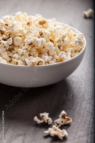 Olive oil popped popcorn in a porcelain bowl side view