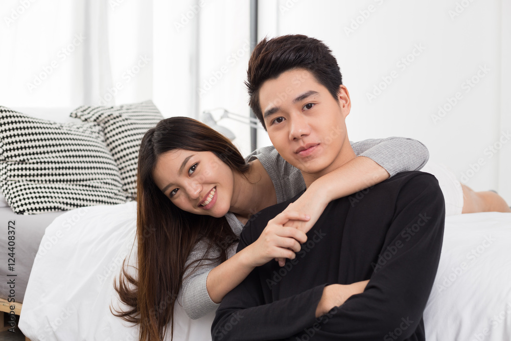 Fototapeta premium Asian couple chilling at home