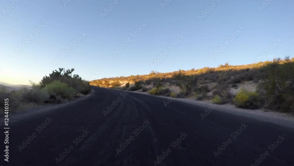 Dawn driving time lapse on Red Rock Canyon National Conservation Area scenic loop road. A popular natural destination 20 miles from the Las Vegas strip. Dawn driving time lapse on Red Rock Canyon National Conservation Area scenic loop road. A popular natural destination 20 miles from the Las Vegas strip.