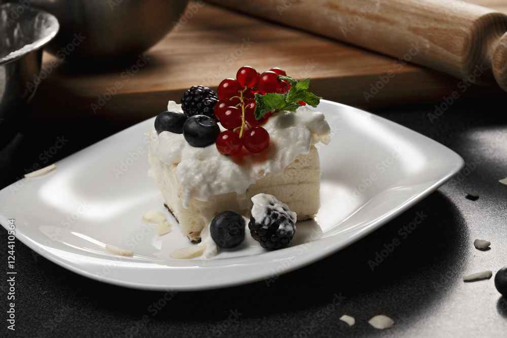 Cremeschnitte with berries and ingredients closeup Cremeschnitte with berries and ingredients closeup