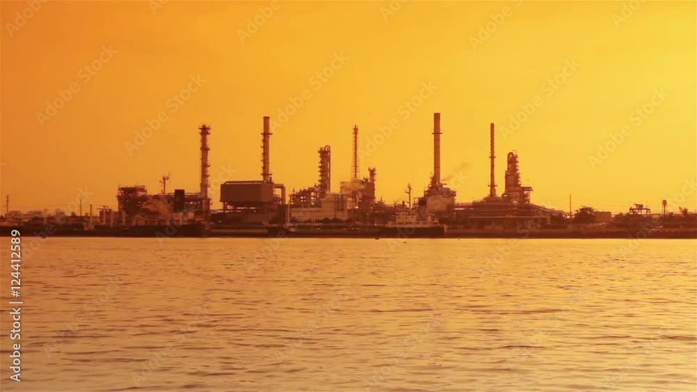 River and oil refinery factory.Time lapse shot. River and oil refinery factory.Time lapse shot.