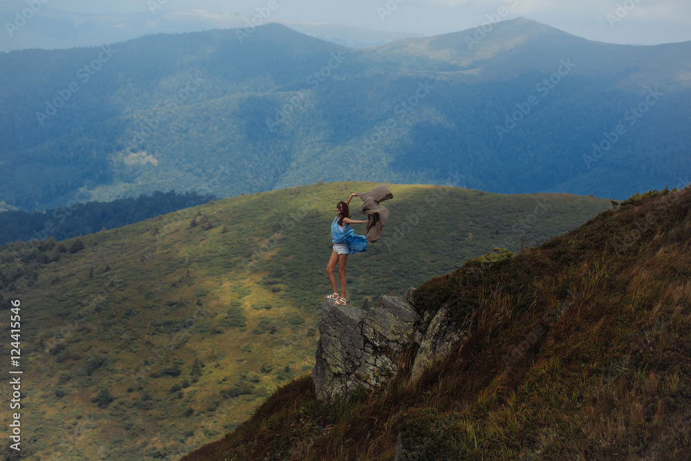 Pretty girl on mountain slope Pretty girl on mountain slope