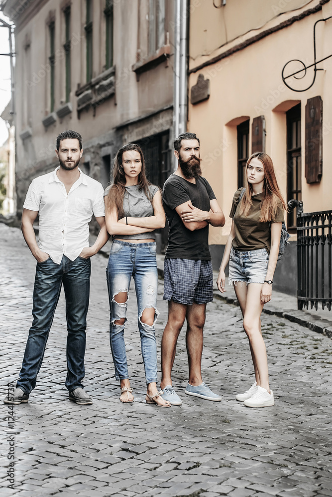 Four friends standing on street Four friends standing on street
