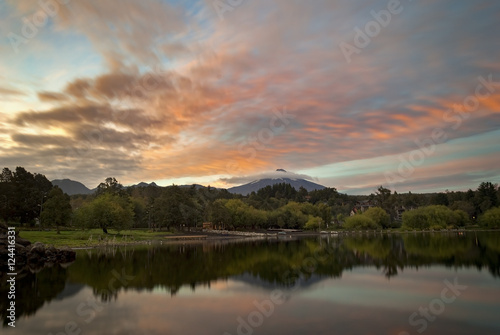 Active volcano Villarrica at morning sunrise reflection in lake Mallalafquén, Pucon, Chile