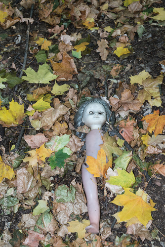 Abandoned toy doll outside kindergarten. Kopachi village,Chernobyl photo