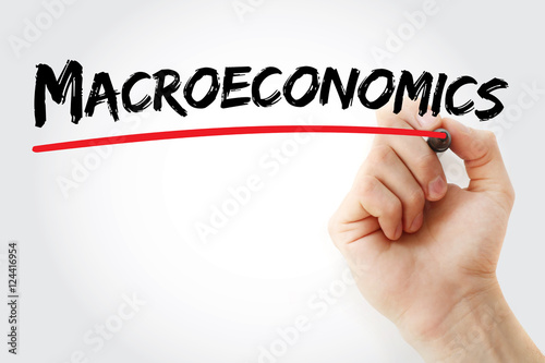 Hand writing Macroeconomics with marker, concept background photo