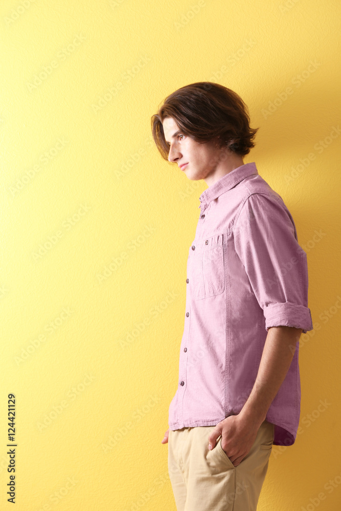 Obraz premium Handsome young man on yellow background