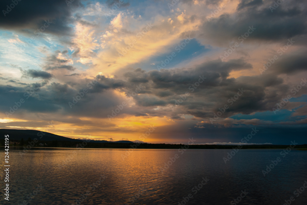 cloudy dramatic sunset on the lake