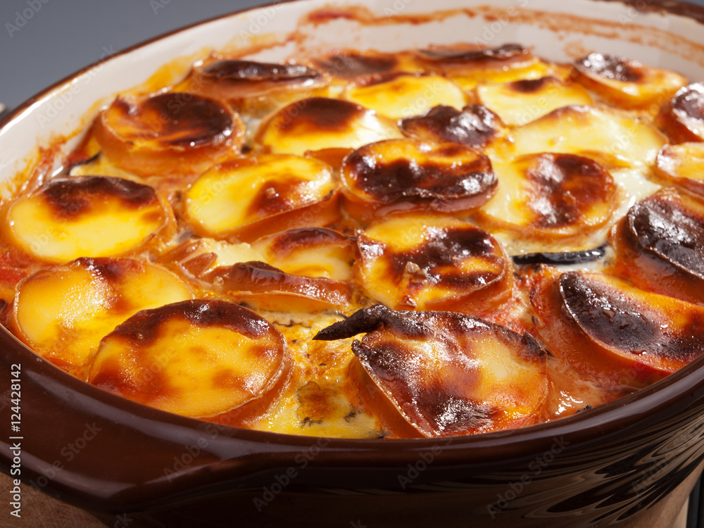 Potato casserole with smoked cheese. Baked. Close up Potato casserole with smoked cheese. Baked. Close up