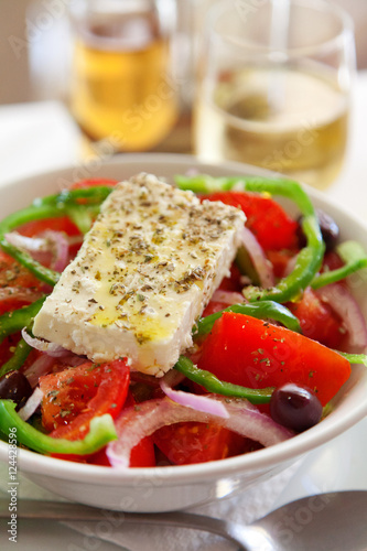 Greek salad with tomatoes,peppers,onions and feta cheese.