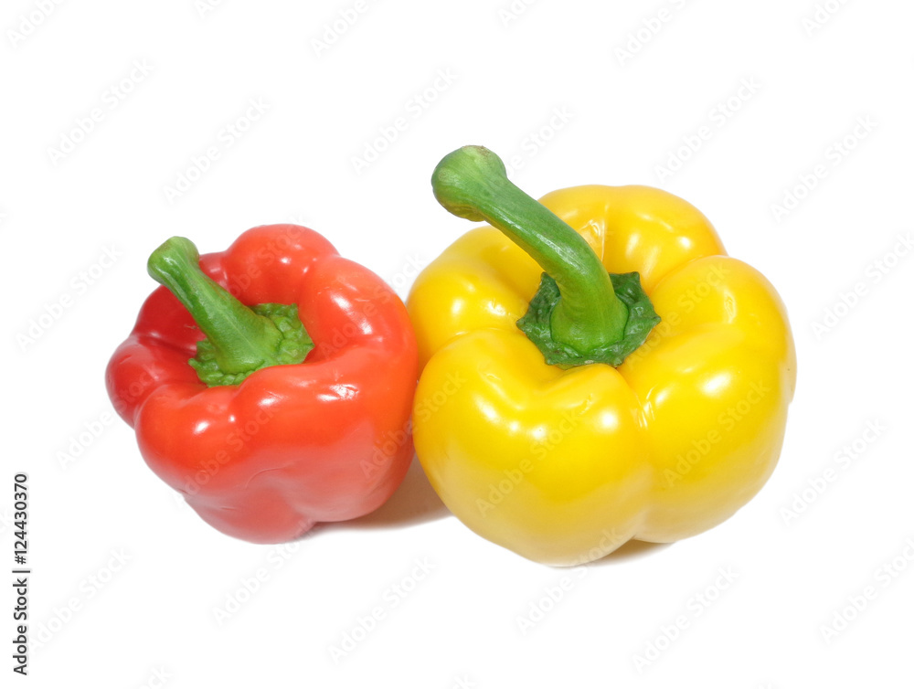Close-up of two ripe bright color bell peppers with green stem, one red and one yellow isolated on white background Close-up of two ripe bright color bell peppers with green stem, one red and one yellow isolated on white background