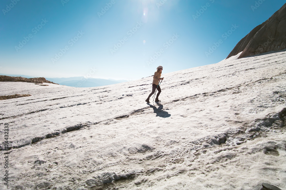 Woman Traveler climbing Travel Lifestyle concept mountains glacier on background Summer vacations activity outdoor Woman Traveler climbing Travel Lifestyle concept mountains glacier on background Summer vacations activity outdoor