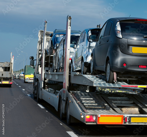 Fotografie, Obraz The trailer transports cars on the highway