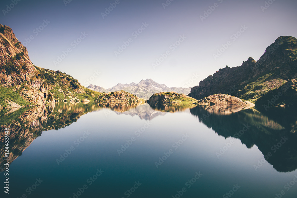 Landscape of beautiful Lake with Rocky Mountains reflection Summer Travel serene minimalistic view