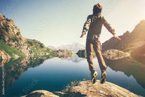 Εκτύπωση καμβά Man jumping Flying levitation with lake and mountains on background Lifestyle Tr