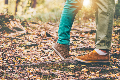 Happy Couple Man and Woman Feet in Love Romantic Outdoor Lifestyle with Autumn nature on background Lifestyle Fashion trendy style