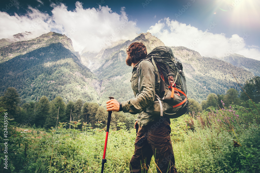 Foto Stock Man explorer with backpack hiking Travel Lifestyle concept  beautiful mountains landscape on background adventure vacations outdoor |  Adobe Stock