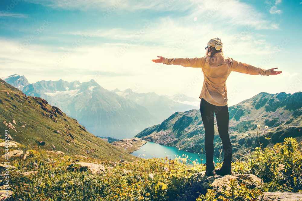Fototapeta premium Happy Woman Traveler raised hands mountains and lake landscape on background Travel Lifestyle concept adventure summer vacations