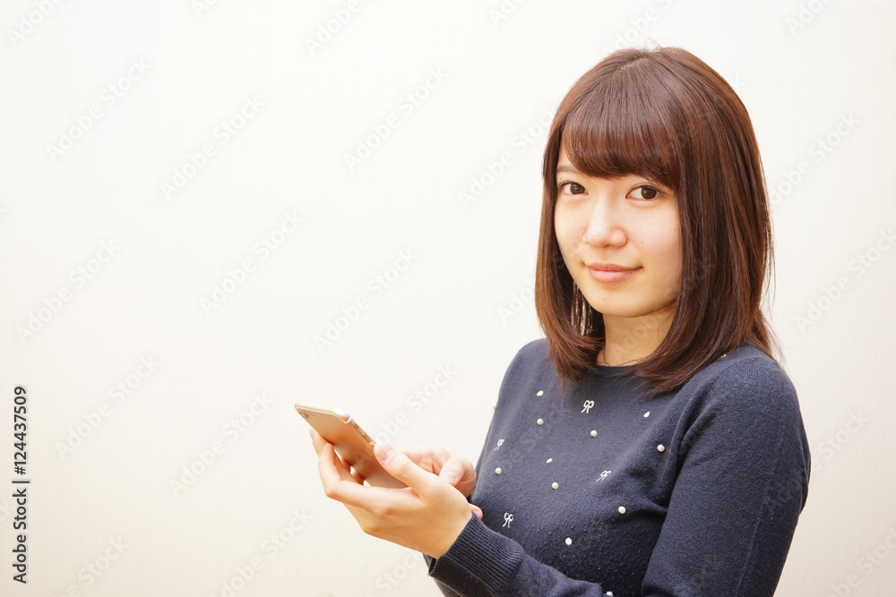 Young attractive woman using her smart phone Young attractive woman using her smart phone