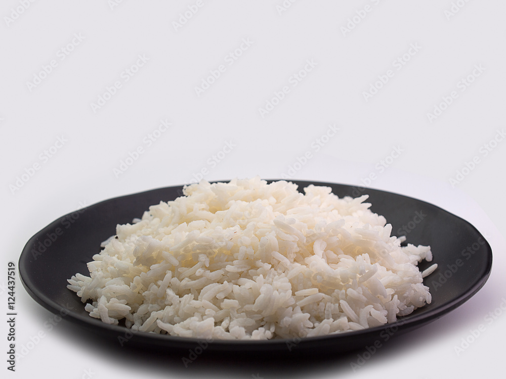 bowl full of rice on white bowl full of rice on white