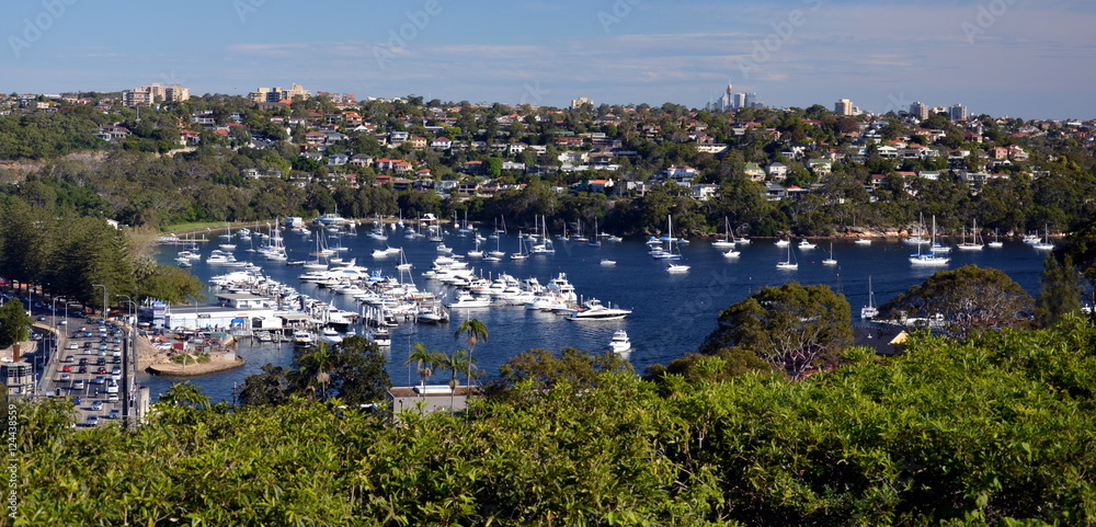 Middle Harbour with moored yachts. Mosman and Sydney CBD in the background.