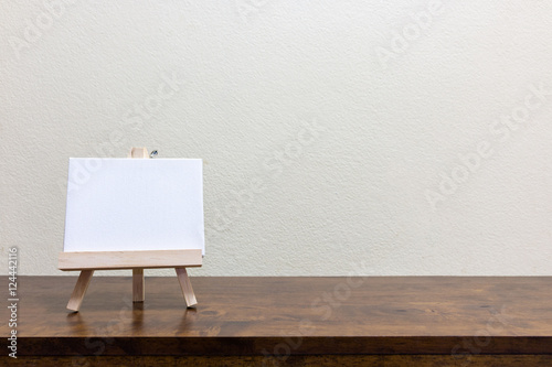 Empty blank whiteboard on the wooden table