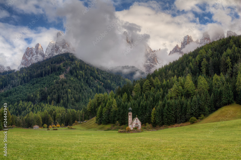 Catholic chapel at the foot of the Dolomite Mountains