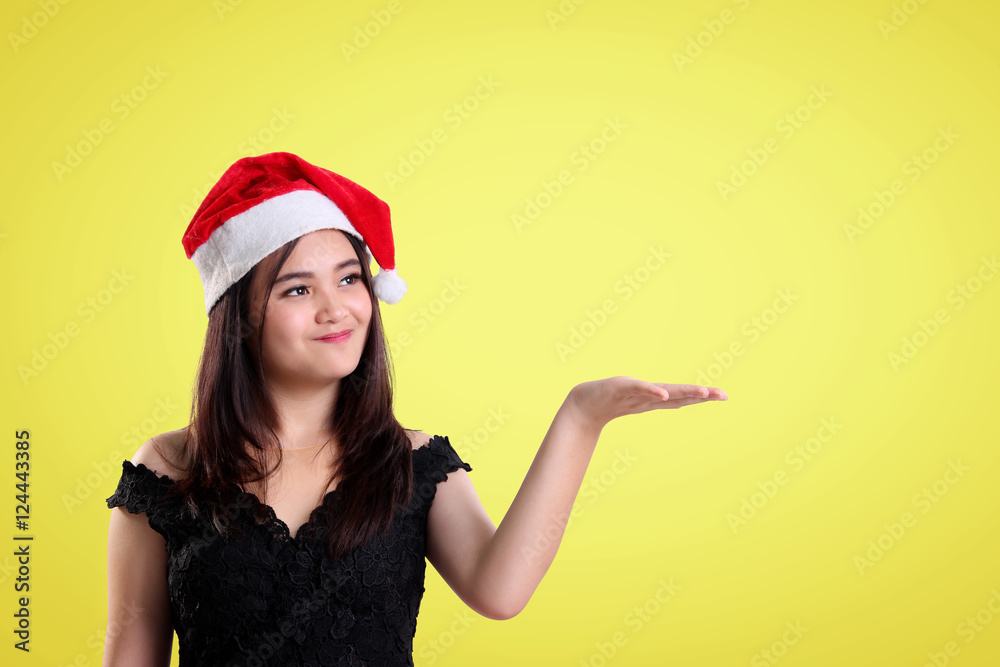 Christmas presentation of a merry girl over yellow background Christmas presentation of a merry girl over yellow background