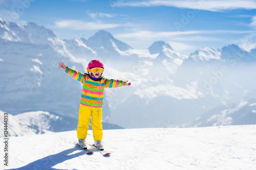 Little child skiing in the mountains