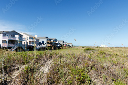  Luxury beach vacation houses across the green sand dunes, in Sunset Beach, North Carolina.  © Richard McGuirk