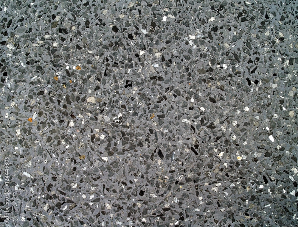 Obraz premium dark gray concrete mixed small marble fragments and gravel stone, interior bathroom tiles floor