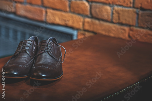 black learher shoes on a table
