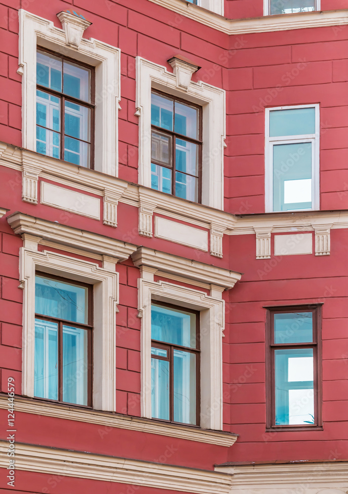 Several windows in row on corner of facade of urban apartment building front view, St. Petersburg, Russia. Several windows in row on corner of facade of urban apartment building front view, St. Petersburg, Russia.