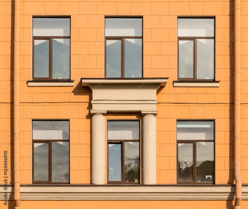 Several windows in a row on facade of Secondary school №243, St. Petersburg, Russia.