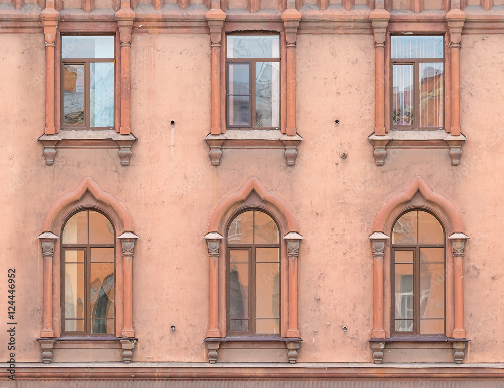 Several windows in a row on facade of St. Petersburg Medical Center front view, Russia.